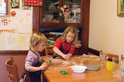 Josie and Celia rolling out cookies