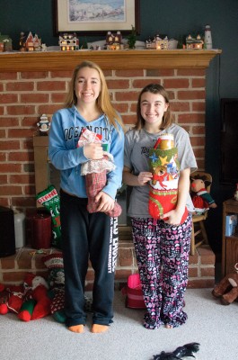 Abby and Ally holding their stockings