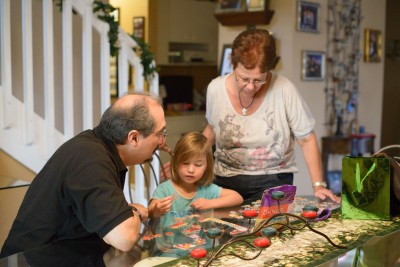 Gilbert, Celia and Tere doing a puzzle